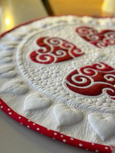 a red and white plate with hearts on it