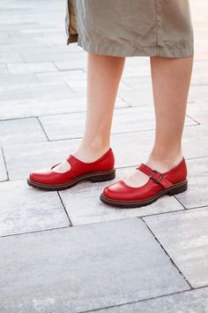 "Our red Mary Janes shoes are a classic style of footwear, round toe, a low heel, and a strap across the instep that fastens with a buckle. Crafted from soft, high-quality leather, our Red Mary Janes are perfect for any season. They feature a flat sole and a slight 2 cm heel, providing both comfort and style. Whether you're dressing up for a night out or running errands during the day, these shoes will keep your feet comfortable and looking great. So why wait? Add some pop to your wardrobe with our women Red Mary Janes today! Key features: 1. Handcrafted in our workshop in Kyiv. 2. Made from 100% natural soft leather. 3. Removable insole, so you can use your own orthopedic insole. 4. Fits true to size for the US.  5. You can order these shoes in other colors by filling out the \"Personaliz Medium Width Low Heel Mary Janes With Buckle, Summer Mary Janes With Leather Sole And Round Toe, Summer Mary Janes With Leather Sole And Flat Heel, Summer Flat Heel Mary Janes With Leather Sole, Spring Mary Janes With Removable Insole And Almond Toe, Spring Mary Janes With Almond Toe And Removable Insole, Leather Mary Janes With Low Heel, Mary Jane Heels With Red Sole And Round Toe, Classic Summer Mary Janes With Round Toe