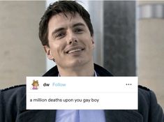 a man is smiling and holding up a tweet that reads,'dw follow a million deaths upon you gay boy '