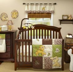 a baby crib in a nursery with winnie the pooh bedding and accessories