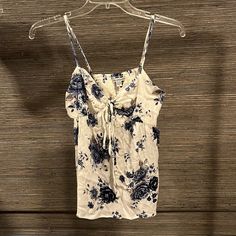 American Eagle Spaghetti Strap Tank Top Size Small Brand New With Tags Spring Floral Print Spaghetti Strap Tops, White Floral Print Camisole For Vacation, Floral Print Spaghetti Strap Top For Beach, Floral Print Top With Spaghetti Straps For Beach, Summer Floral Print Camisole Top, Floral Print Cami Top For Day Out, Casual Cotton Camisole With Floral Print, Casual Beach Camisole With Floral Print, Summer Floral Print Cami Top