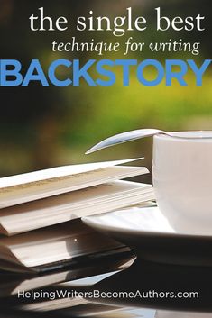 a stack of books sitting on top of a table next to a cup and saucer