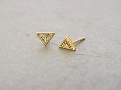 Little Art Deco inspired triangle stud earrings in solid 18k yellow, rose or white gold. Dainty little studs perfect for wearing everyday, and comfortable enough to never take off!  Each little stud is handcrafted using solid 18k yellow or rose gold and adorned with the tiniest of detail using the technique of millegrain or beading to catch the light and give them a sparkle. With solid 18k posts and butterfly backs each stud measures 8mm wide by 6mm high. Please choose from yellow, rose or white Bay Photography, Triangle Stud Earrings, Minimal Jewellery, Lock Jewelry, Earrings Art Deco, Tiny Art, Rose Gold Earrings Studs, Triangle Earrings Stud, Gold Triangle