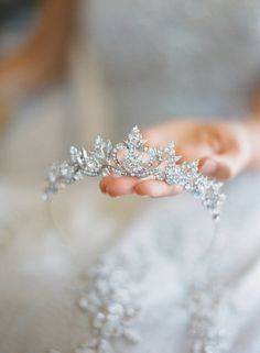 a person holding a tiara in their hand