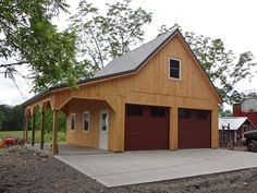 a two car garage with an attached carport