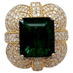 This beautiful vintage-inspired ring features a 8.08 ct emerald center stone embellished with 2.27 total ct of round diamonds set on a 14k yellow gold band. Ring can be sized upon purchase. Kubler Ross, Yellow Gold Cocktail Ring, Vintage Cocktail Ring, Round Diamond Setting, Emerald Diamond Ring, Gold Cocktail Ring, Diamond Free, Gold Cocktail, 18k Yellow Gold Ring