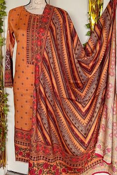 It is a beautiful ready to wear suit for women. It is available in 2 sizes . Small  Chest 38 inches all around, waist 38, hips 40 and length 42 inches. Xtra large  Chest 48 inches all around, waist 47, hips 52 and length 42 inches. It is a beautiful printed kameez with lace on it. It comes with full size printed dupatta and plain pant. It is a bin saeed branded suit. Color copper. Fabric linen. No return or exchange please . Bohemian Style Kurta With Digital Print For Festive Season, Bohemian Digital Print Kurta For Festive Occasions, Bohemian Style Festive Kurta With Digital Print, Bohemian Digital Print Palazzo Set For Eid, Semi-stitched Anarkali Set With Digital Print, Traditional Digital Print Palazzo Set For Diwali, Orange Bohemian Set For Eid, Bohemian Orange Sets For Eid, Bohemian Orange Set For Eid