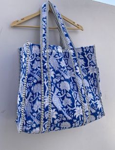 cotton print Bag The Indian Hand Block Printed Cotton Quilted Women's Handbags from Rajasthan India. This Handbag is completely Indian Printed on good quality cotton. Cotton quilted Jhola Bag made by Indian Artisans, this cotton quilted shopping bag is totally unique and multi purpose. Use this for your grocery or as a travel bag. Perfect to suit all. Item :- Cotton Handbag Material: Quilted Cotton Fabric Color - rainbow Pattern : Block Print Style: Tote Bag, Handle Bag, Shoulder Bag Size in Inch:- Height-18" inch Width- 19" inch Handle-13" inch Product Work: Printed & quilted Stitched Usage : Cosmetic, Make-up, Travel, Toiletries, Medicine, Accessories, Shopping and much more. Perfect for Beach Visits/ Quick Grocery runs/ Carrying Kids items/ Artist Paint book and Paints /Extra Bag Washab Bohemian Cotton Canvas Bag For Daily Use, Blue Rectangular Canvas Bag For Beach, Vacation Cotton Tote Shoulder Bag, Blue Canvas Beach Bag For Shopping, Rectangular Cotton Summer Bag, Summer Rectangular Cotton Bag, Cotton Shoulder Beach Bag, Cotton Shoulder Bag With Double Handle For Vacation, Blue Cotton Canvas Bag For Vacation