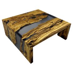 a coffee table made out of wood and black glass inlays on the top