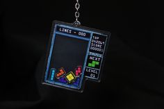 a keychain with an image of a game being played on the computer screen