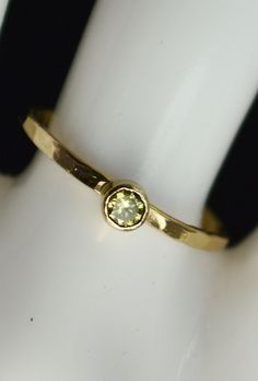 "Grab 5 Hammered 14k Gold Filled stackable mothers rings with birthstones of your choice. Simple, rustic, Everyday Ring. Perfect for a flash of gold and color on the hand, without being to \"much.\" - High quality 14k gold fill bands, and Solid 14k gold bezels. - 3mm Lab grown gemstones. Natural Stones Available. - Delicate hand-hammered texture. - Made to order, just for you. **When you place your order indicate the 5 birth months you want in the note to seller box at checkout.** If you want le Gold Adjustable Birthstone Ring With Diamond, Adjustable Gold Birthstone Ring With Single Diamond, Gold Solitaire Birthstone Ring For May, Gold Solitaire Birthstone Ring With Round Stone, Gold May Birthstone Ring With Round Stone, Gold Birthstone Ring For May With Round Stone, Gold Stackable Rings With Birthstone, Gold Sapphire Solitaire Ring For May Birthstone, Gold Sapphire Birthstone Ring With Round Band