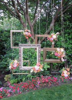 wedding decorations and flowers hanging from the trees