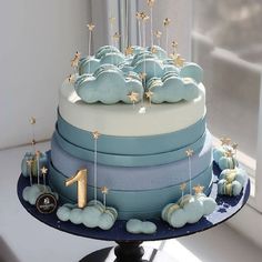 a blue and white cake sitting on top of a table