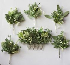 the hair combs are adorned with flowers and greenery