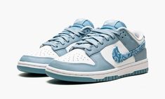 The Women’s Nike Dunk Low “Blue Paisley” is a women’s-exclusive colorway of the classic basketball and lifestyle shoe that modifies the shoe’s iconic Swoosh branding in an interesting way.  One of several “Paisley” Dunks released for women in 2022, the “Blue Paisley” features the same two-tone color block of many legendary Dunk styles, albeit with a modified blue paisley Swoosh on the sides that replaces the model’s standard leather branding.  The upper features white leather on the perforated t Womens Dunk Low, Dunk Low Blue, Sneakers Box, Kobe Shoes, Cute Nike Shoes, Cute Nikes, Sb Dunk, Swag Shoes, Basketball Sneakers