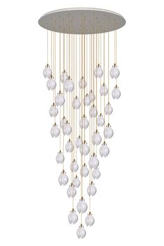 a chandelier with white and gold balls hanging from it's center circle