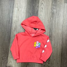 Get Your Little One Ready For Fun And Play With This Smiley Flower & Hearts Hoodie! Made Of Soft Vintage Fleece Fabric, This Pullover Hoodie Features A Colorful Smiley Flower Graphic And Comes In A Vibrant Flame Red Color. Fabric Content: 60% Cotton 40% Polyester Cute Cotton Hoodie For Spring, Cute Cotton Spring Hoodie, Pink Casual Hoodie For Playtime, Casual Pink Hoodie For Playtime, Playful Hoodie For Spring Playtime, Playful Spring Hoodie For Playtime, Playful Hoodie For Playtime In Spring, Playful Pink Hoodie For Playtime, Playful Hooded Hoodie For Spring