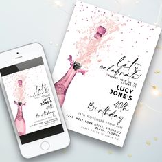 an iphone next to a pink champagne bottle on a white background with confetti