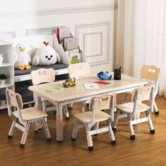 a child's table and chairs in a room