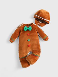 a baby's brown outfit and hat laying on top of a white surface,