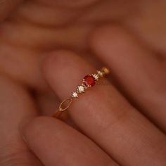 Dainty Ruby Gold Ring, July Birthstone Rings, Ruby Diamond Ring, Red Ruby Stacking Ring, Genuine Ruby Rings, Graduation Ring, Casual Rings We use the highest quality moissanite! Moissanite: ✦ Color: D Colorless ✦ Clarity: VVS1 OR All our diamonds are 100% natural. We use only conflict-free diamonds and gemstones. Diamond: ✦ Color: F-G ✦ Clarity: SI1-VS ✦PRODUCT DETAILS✦ → center stone: natural ruby → accent stone: diamonds Also available in other colored gemstones upon request. Please get in tou Fine Jewelry Red Ruby Ring, Ruby Ring With Diamond Accents, Round Ruby Ring With Gemstone Accents, Red Garnet Round Band Jewelry, Red Gemstone Accented Round Rings, Elegant Red Garnet Stackable Rings, Red 14k Gold Birthstone Ring For Promise, Open Ring With Ruby And Accent Stones, Red Ruby Birthstone Ring In Fine Jewelry Style