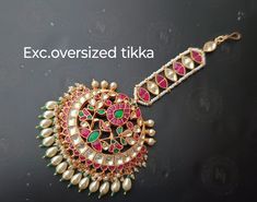 Elegance of timeless Real Pachi Kundan combined with high grade Beads. This delicate mangtikka is set in copper alloy and plated with 22k gold.It will go with everything and make your outfit super chic. 100% top Quality  -22K gold and silver Plated silver copper alloy. Multicolor * Our all jewelry is made from semiprecious stones and beads. Care Tip - 1. Keep away from moisture and perfume 2. Store in cotton or zip lock bags or air tight boxes. 3. Spot cleaning only. About us: kundanjewelsbyshiv is a pioneer firm in the semi-precious jewellery business in the city of Pune. We offer a wide variety of products from heavy necklaces to hath fool and gorgeous mathapattis. We also have customised exclusive designs for brides around the globe. Be it your engagement, wedding or a reception party W Traditional Green Tikka For Festive Occasions, Traditional Green Festive Tikka, Bollywood Style Tikka For Eid Festivities, Traditional Green Tikka For Diwali, Green Traditional Tikka For Diwali, Bollywood Style Festive Ceremonial Tikka, Traditional Kundan Tikka With Motifs, Multicolor Tikka With Zari Work For Festivals, Traditional Tikka With Mirror Work For Eid