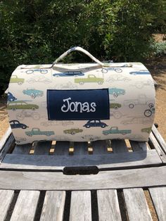 a suitcase sitting on top of a wooden bench