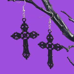 A pair of statement dangle earrings with large black cross charms on 925 sterling silver ear wires.  ✨ DETAILS: - Black metal cross charm 5.7cm x 3.7cm - 925 sterling silver ear wires 🕸️ MATCHING ITEMS 🕸️ GOTHIC CROSS CHOKER: https://www.etsy.com/uk/listing/1115524210/gothic-cross-velvet-choker-various?click_key=dc02222e5f89f5845d6c1f5408a2b634dc2dc9c5%3A1115524210&click_sum=25c7c0d8&ref=shop_home_feat_2 🎃 Shop our Halloween collection here: https://www.etsy.com/uk/shop/BadGhoulsClubUK?sectio Black Cross Jewelry For Halloween, Black Cross Pendant Jewelry For Halloween, Black Cross Earrings For Pierced Ears, Gothic Cross Jewelry With Pierced Details, Gothic Cross Pierced Jewelry, Pierced Gothic Cross Jewelry, Black Gothic Cross Earrings, Black Cross Earrings As Gift, Black Cross-shaped Earrings For Gift