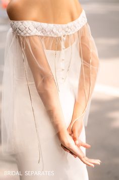 Handmade romantic bridal cape by yours truly. Standard size Length : Center front and back length 22 cm/ 8.5 in Side length 50 cm/ 20 in Around the shoulder circumference: 100 cm/ 40 in Color : White Light ivory Ivory Materials : tulle, sequin fabric, rhinestone crystal trim Details: Off shoulder bridal cape with sequin fabric and rhinestone crystal trim Back closure with button Shop other BRIDAL CAPES here : http://etsy.me/2lkNuz7 Turnaround time: Due to the delicate nature of the handcrafted g White Wedding Gown With Cape Sleeves, Organza Wedding Dress With Sheer Dupatta For Ceremony, Wedding Tulle Fabric, Wedding Dress With Sheer Dupatta And Lace, Wedding Lace Dress With Sheer Dupatta, Sheer Dupatta Lace Wedding Dress, Blush Veil, Bridal Capes, Bridal Bolero Jacket