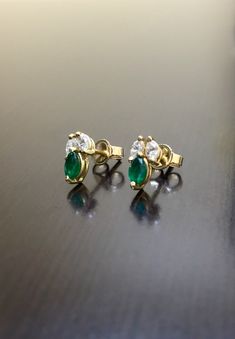 DeKara Designs Collection Metal- 14K Yellow Gold, .583 Stones- 2 Marquise Shaped Colombian Emeralds 0.48 Carats, 4 Marquise Diamonds G Color VS2 Clarity 0.38 Carats. Measurement- .44 Inches Long, .21 Inches Wide. Handmade 14K Yellow Gold Diamond Emerald Diamond Earrings. Each piece is handmade, individually set and put together. The earrings feature two beautiful marquise diamonds on top with a marquise emerald on the bottom. All the stones are expertly prong set. The backing of the earrings fea Marquise Emerald Jewelry Gift, Green Marquise Earrings For Anniversary, Green Marquise Earrings In Fine Jewelry Style, Marquise Emerald Yellow Gold Jewelry, Green Multi-stone Earrings For Anniversary, Fine Jewelry Green Marquise Earrings, Green Marquise Fine Jewelry Earrings, Green Marquise Earrings Fine Jewelry, Multi-stone Emerald Earrings For Gift