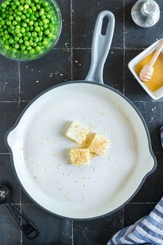 a pan with some food on it next to other ingredients