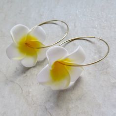 Plumeria Flower Hoops Fun Hawaiian white and yellow plumeria flowers on 14k gold fill endless hoops. Hoops approx. 50mm. Shop~ http://www.etsy.com/shop/HanaMauiCreations?ref=pr_shop_more International buyers please read our shipping policies before ordering~ POLICIES~ https://www.etsy.com/shop/HanaMauiCreations/policy?ref=shopinfo_policies_leftnav Gold Hoop Flower Earrings For Summer, Gold Hoop Earrings For Summer Wedding, Adjustable White Hoop Earrings For Wedding, Gold Flower Jewelry For Beach, Summer Gold Hoop Flower Earrings, Gold Flower Earrings For Beach, White Flower Shaped Jewelry For Beach, White Flower-shaped Hoop Earrings With Ear Wire, Hawaii Beach Party