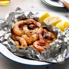 food network campfire recipe garlic shrimp on foil with lemon wedges and hot pepper