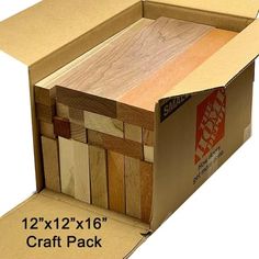 an open cardboard box filled with wooden planks