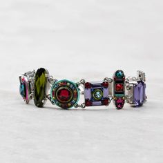 This bright, jewel-encrusted Firefly La Dolce Vita Bracelet is inset with a combination of Swarovski crystals and fire-polished Czech glass beads. The glittering combination of rose, aquamarine, amethyst, and amber shades adds sparkle and shine to every outfit. You'll love wearing the Firefly La Dolce Vita Bracelet. Color: Multicolor Silver-plated, antiqued, hypoallergenic steel chain, setting, and clasp Clean with a soft jewelry polishing cloth. Never clean with any chemicals, chlorine, or blea Elegant Multicolor Crystal Bracelet With Sparkling Stones, Luxury Jeweled Crystal Bracelets, Modern Multicolor Jewelry With Stones, Elegant Multicolor Crystal Bracelet With Rhinestones, Elegant Multicolor Crystal Gemstone Bracelet, Elegant Multicolor Gemstone Crystal Bracelet, Elegant Multicolor Crystal Rhinestone Bracelet, Elegant Multicolor Crystal Bracelet, Modern Multicolor Stone Jewelry