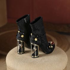 These Embroidered Crystal Ankle Boot Heels embody a fusion of classic and modern runway style. Handcrafted from velvet, with crystal elements and a stylish floral pattern, these luxury ankle boots fit true to size for an ideal blend of fashion and comfort. Featuring a pointed toe and super high 10cm heel, you will make an elegant entrance in any setting. Heel Type: Runway StyleBoot Type: Modern BootsShaft Material: VelvetSeason: Spring/AutumnUpper Material: VelvetBoot Height: ANKLEStyle: retrois Elegant Embellished Ankle Boot Heels, Luxury High Ankle Party Heels, Elegant Embellished Ankle Boots, Elegant Embellished Ankle Heeled Boots, Luxury High Ankle Boots For Party, Winter Formal Embellished Boots, Elegant Embellished Heeled Boots For Winter, Elegant Embellished Ankle-high Boots, Fall Embellished Heeled Boots For Formal Occasions