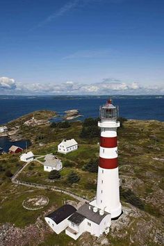 an aerial view of a lighthouse on the coast