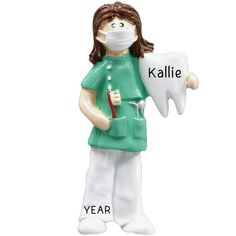 a ceramic figurine of a nurse holding a toothbrush and dental floss