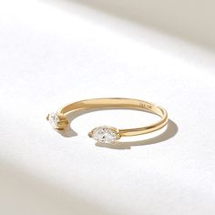 Elegant& Minimalist Real Solid Gold Open Stackable Ring with half bezel settled natural marquise diamonds Features * Made to Order. * Gold KT: 10K, 14K, 18K * Custom Gold Color: Rose Gold, Yellow Gold, White Gold * Diamond Color-Clarity: D-E-F color VVS clarity * Total CTW: 0.18 ctw * Width of Band: 1.43MM * Thickness of Band: 0.67MM * Ready to Ship in 5-7 Business Days ✓ We care about the environment,the jewelry we cast is made with recycled gold. We source exclusively post-consumer material th Luxury Open Band Solitaire Jewelry, Luxury Open Ring Stackable Rings With Bezel Setting, Luxury Classic Engraved Open Band Ring, Luxury Wide Band Open Ring For Promise, Open Wedding Ring, Elegant Adjustable Birthstone Toe Ring, Adjustable Open Diamond Ring For Anniversary, Elegant Si Clarity Diamond Ring For Anniversary, Modern Halo Jewelry For Wedding