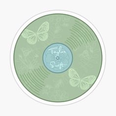 a green disc with butterflies on it and the words taylor & smith written in white