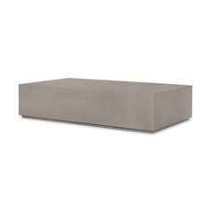 a concrete box sitting on top of a white surface