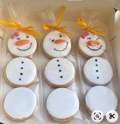 six decorated cookies in the shape of snowmen