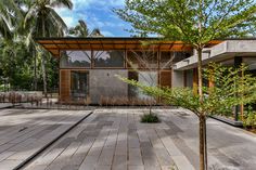 an empty patio in front of a modern house