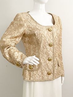 This is a pretty gold jacket from Bill Blass.  The jacket is gold with an overlay of gold netting with metallic embroidered flowers.  The jacket is trimmed with gold braid and has fabric covered buttons.  The neck has additional snaps at the top.  Fully lined.  Size tag 10, check measurements carefully.  Please note there is some staining on the lining.  Does not detract from piece, priced accordingly.   Measurements taken with jacket laying flat and doubled where appropriate. In order to determ Jacket Formal, Formal Jacket, Gold Jacket, Sailor Dress, Bill Blass, Lace Jacket, Gold Lace, Fabric Covered Button, Womens Blazers