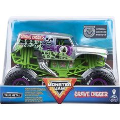 the monster truck is green and has purple wheels