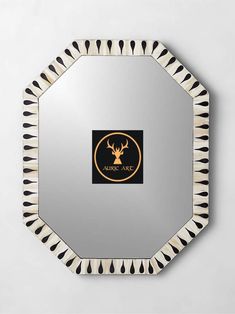 a mirror with an antelope logo on it