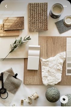 the table is covered with various items such as paper, scissors and paintbrushes