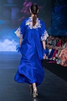 Blue silk kaftan featuring resham embroidered floral motifs, embellished by beads, sequins, pearls on a pleated flared silhouette, cut-out borders and side slits. Comes with inner tunic. - Aza Fashions Kaftan Women, Silk Kaftan, Cape Sleeves, Blue Silk, Silhouette Cut, Floral Motifs, Embroidered Silk, Blue Beads, Aza Fashion