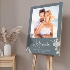 an easel with a welcome card on it