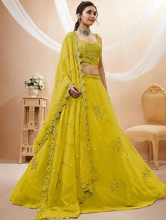 Introducing our adorable neon yellow sequins georgette wedding wear lehenga choli, a vibrant and stylish outfit that is perfect for any special occasion. This exquisite piece is made from high-quality georgette material in a stunning neon yellow color. It features intricate dori work, glitter sequin work, and embroidery work, adding a touch of elegance and glamour to the ensemble.
The set includes a matching georgette choli that is adorned with the same dori work, glitter sequin work, and embroi Yellow Embellished Sharara For Navratri, Yellow Organza Sets With Mirror Work, Yellow Embellished Dress For Navratri, Embellished Yellow Dress For Navratri, Embellished Yellow Choli With Traditional Drape, Embellished Yellow Sharara For Diwali, Diwali Yellow Embellished Sharara, Embellished Yellow Sets For Reception, Yellow Embellished Georgette Traditional Wear